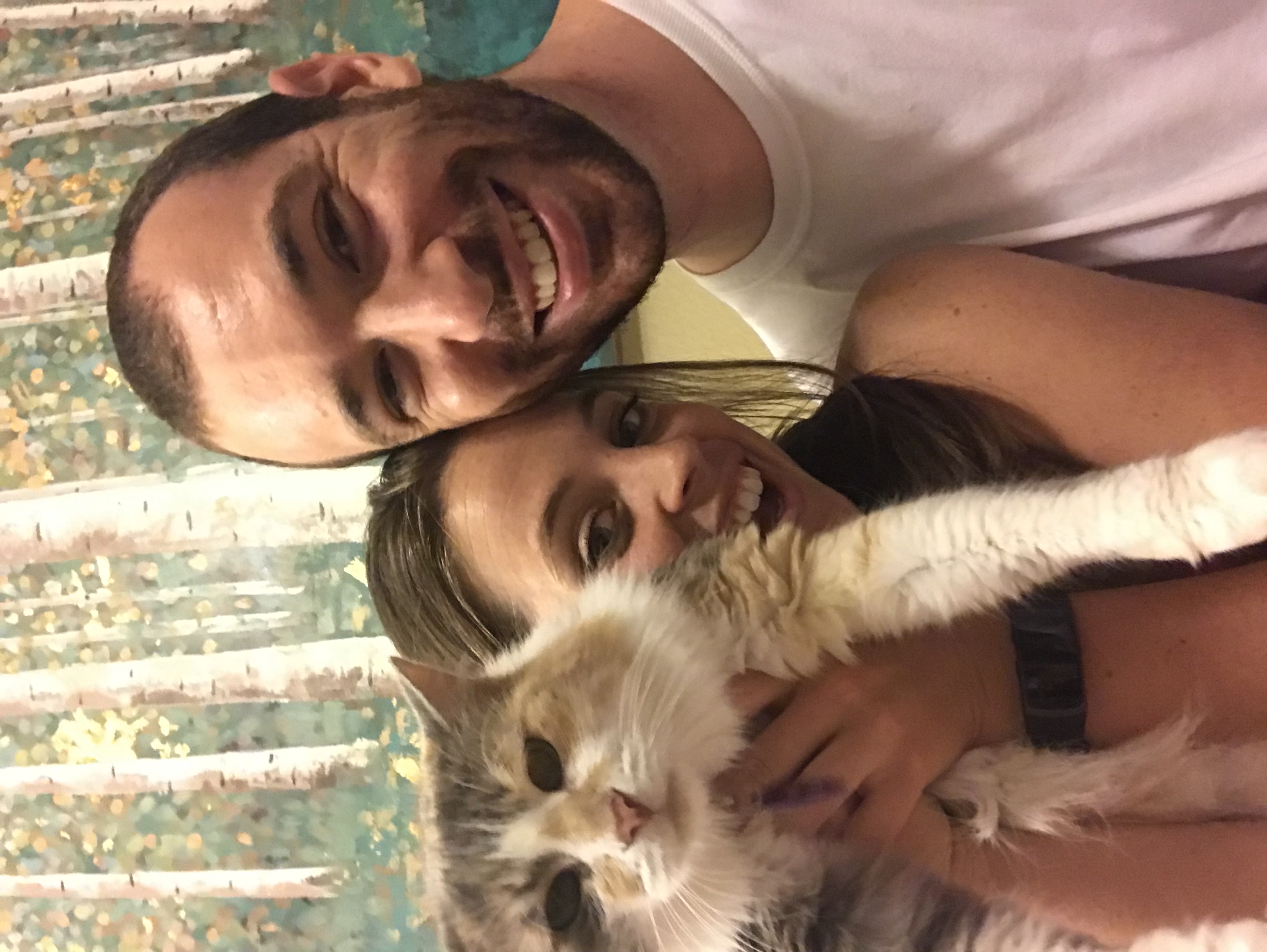 A fluffy cat with her people