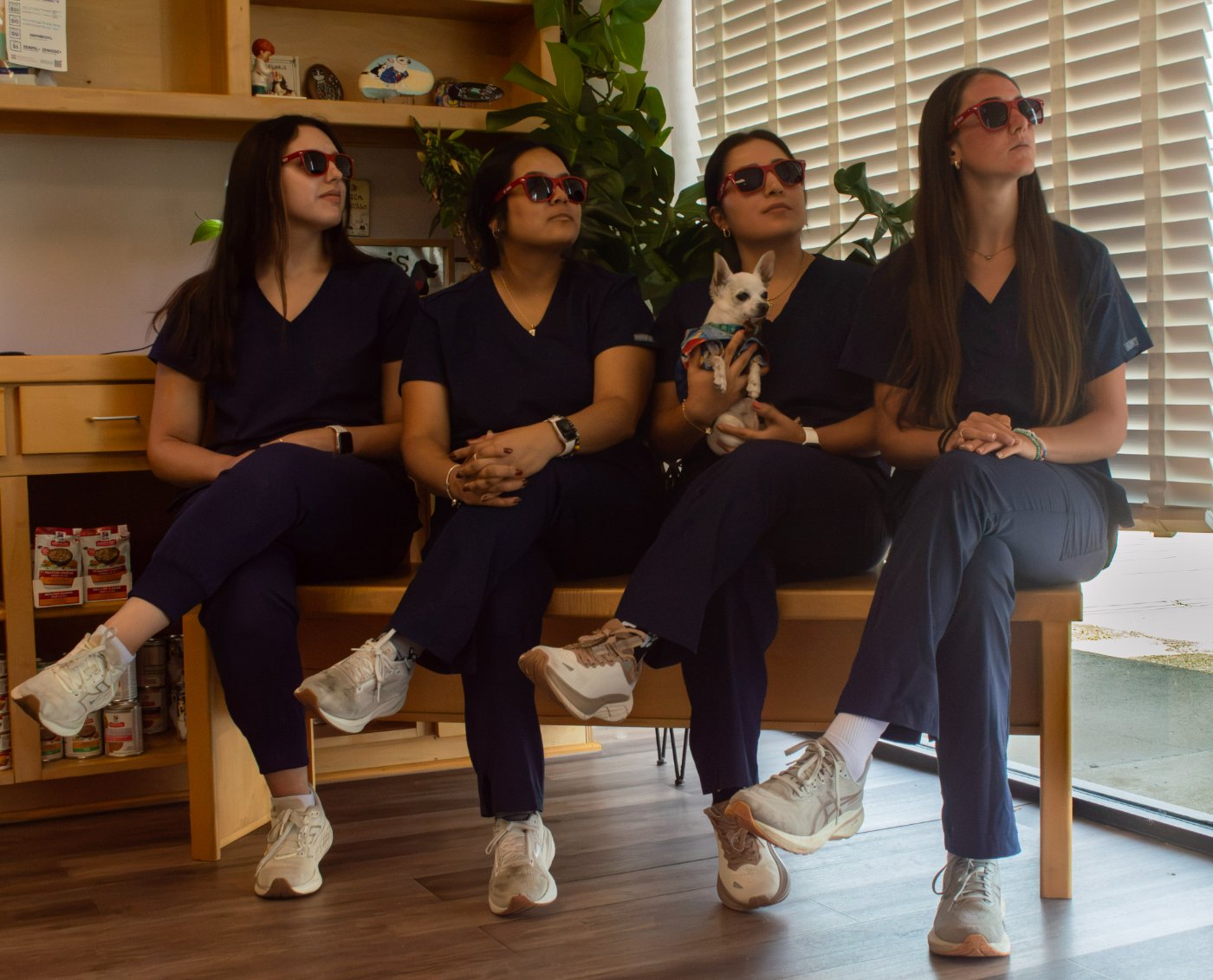 The crew in matching red sunglasses